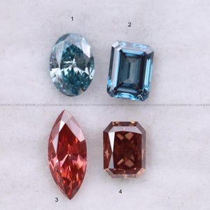 May include: Four faceted gemstones arranged in a grid. Number 1 is an oval-cut blue stone, number 2 is a rectangular emerald-cut blue stone, number 3 is a marquise-cut reddish-orange stone, and number 4 is a rectangular radiant-cut brown stone.
