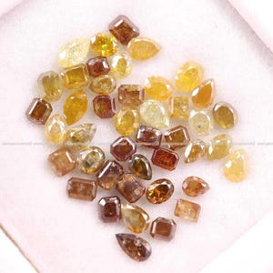 Natural Rustic Yellow & Brown Diamond Lot, Mixed Shape Rose Cut Loose Diamonds, Real Earth-Mined Stones for Custom Jewelry
brilliant cut diamonds, mixed color diamonds, brown brilliant diamond, salt and pepper diamonds, fancy color loose diamonds, wholesale diamond lot, loose diamonds for jewelry, handmade jewelry supplies, mixed brilliant cut gems, rustic round diamonds, jewelry designers diamonds, fine jewelry stones, wholesale gemstone supply, brilliant cut diamond mix
