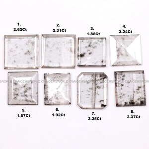 May include: Eight clear, faceted gemstones with dark, moss-like inclusions arranged in two rows. Each stone is numbered 1 through 8 with its specific weight in carats listed below it, ranging from 1.67Ct to 2.62Ct, displayed on a plain white background.