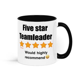 May include: White ceramic mug with a black rim and handle. The mug has black text that reads "Five star Teamleader" with five yellow stars below the text. The text "Verified" is below the stars in smaller font. Below the stars is the text "Would highly recommend" with a smiley face emoji.
