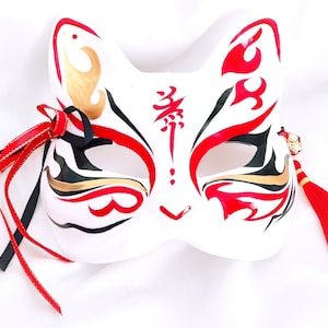 Maschera da Kitsune per uomo, unisex, nera, rossa, gialla. Maschera giapponese fatta a mano, a mezzo volto, in stile anime, con frange.