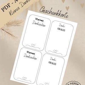 Puede incluir: Una hoja de etiquetas de regalo blancas con las palabras "Kleines Dankeschön" y "Danke FÜR ALLES" impresas. Las etiquetas tienen un diseño de corazón y también se ven las palabras "Download" y "Handmade with Love".
