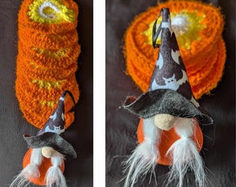 May include: Two Halloween gnome ornaments. One is a stack of orange and yellow crocheted circles. The other is a gnome with a black hat with a white and black pattern, a white beard, and an orange felt circle base.
