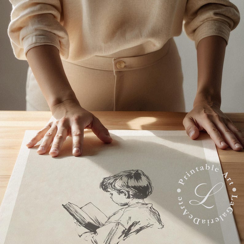 May include: A black and white illustration of a child reading a book. The illustration is on a white sheet of paper with a watermark of the text "Printable Art - La Galleria D'Arte".