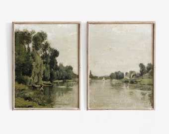 May include: Two framed landscape paintings depicting a river scene with trees and a boat. The paintings are in a muted green and brown colour palette.