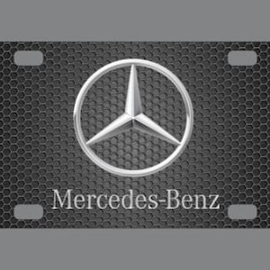 May include: Black and silver metal license plate with a Mercedes-Benz logo and the text "Mercedes-Benz".