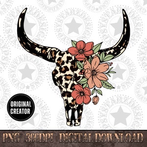 May include: A black and white leopard print bull skull with pink and peach flowers and green leaves.