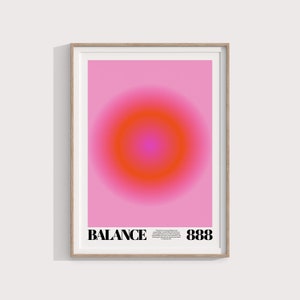 May include: A framed print with a pink background and a large orange circle in the center. The text "BALANCE 888" is at the bottom of the print.