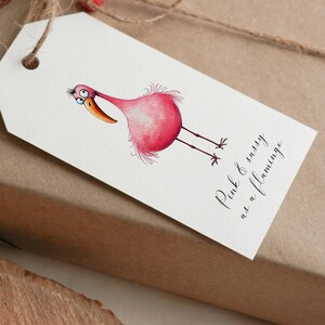 May include: A white gift tag with a pink flamingo illustration and the text "Pink & sassy as a flamingo".