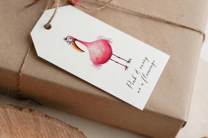 May include: A white gift tag with a pink flamingo illustration and the text "Pink & sassy as a flamingo".