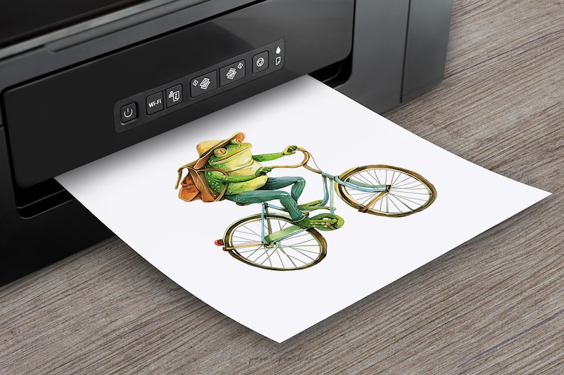 May include: A green frog wearing a brown hat and backpack rides a blue bicycle with a brown basket. The frog is smiling and holding the handlebars. The bicycle has a brown seat and brown wheels.
