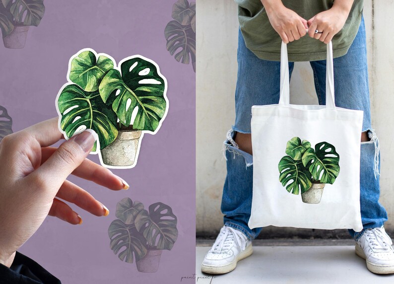 May include: A white tote bag with a green watercolor illustration of a potted monstera plant. The bag has a long handle and is made of canvas.