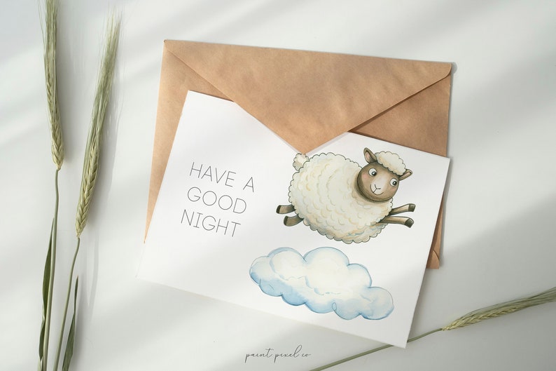 May include: A white card with the text "HAVE A GOOD NIGHT" and a watercolor illustration of a white sheep with brown eyes and hooves flying on a white cloud.