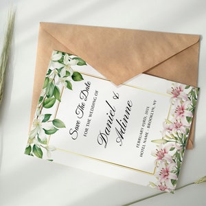 May include: Save the date card with white and pink floral designs. The text reads "Save The Date for the wedding of Daniel & Adinne February 03rd, 2021 Hotel Name - Brooklyn, NY"
