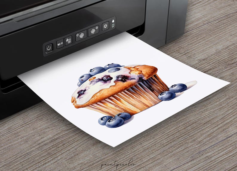May include: A watercolor painting of a blueberry muffin with white frosting and blueberries on top. The muffin is sitting on a white background with more blueberries scattered around it.