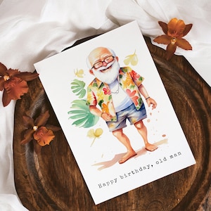 May include: A watercolor illustration of a man with a white beard and glasses wearing a colorful Hawaiian shirt and blue shorts. The illustration is on a white card with the text "Happy birthday, old man".