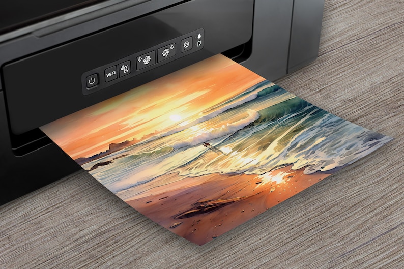 May include: A black printer with a control panel and a colorful sunset beach scene photo printing from the printer.