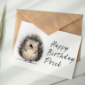 May include: A white card with a cartoon hedgehog illustration and the text "Happy Birthday, Prick".