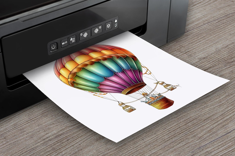 May include: A colorful hot air balloon with a basket and a white background. The balloon is made of a patchwork of different colors, including red, orange, yellow, green, blue, and purple. The basket is made of brown wicker and has a metal frame.
