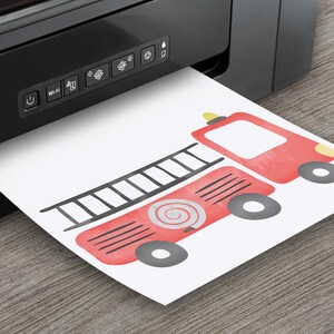 May include: A red fire truck with black wheels and a ladder on the side. The truck has a white spiral hose and a yellow light on top. The image is printed on a white sheet of paper.