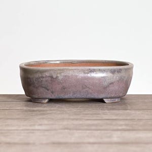 May include: A handmade wooden sign with the text "Welcome to our home" in a handwritten style. The sign is painted white with black lettering and a distressed finish, perfect for home decor.