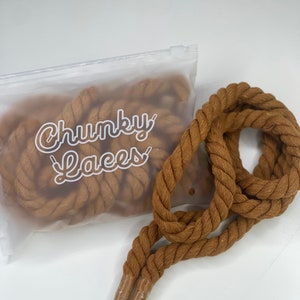 May include: A pair of brown chunky shoelaces in a clear plastic bag with the text "Chunky Laces" printed on the bag.