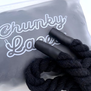 Chunky Laces Black 14mm thick shoelaces 140cm length , made from macrame twisted cotton rope, inside custom Chunky Lace packaging. These premium laces transform classic sneakers with a unique style, merging personal flair with robust aesthetics.