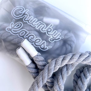 Chunky Laces Grey 14mm thick shoelaces 140cm length , made from macrame twisted cotton rope, inside custom Chunky Lace packaging. These premium laces transform classic sneakers with a unique style, merging personal flair with robust aesthetics.