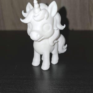 May include: A set of three ceramic mugs with a speckled, matte finish. Each mug features a different color: light blue, cream, and gray. The mugs have a simple, modern design with a rounded shape and a handle.