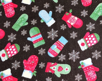May include: A dark background is covered with a pattern of colorful mittens and snowflakes. The mittens are red, green, and blue, with white cuffs and various designs. The snowflakes are white and add to the winter theme.