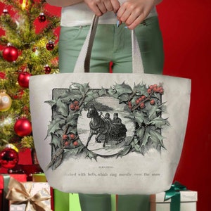May include: A white canvas tote bag with a vintage illustration of a horse-drawn sleigh surrounded by a holly wreath. The text "SLEIGHING. decked with bells, which ring merrily over the snow" is printed below the image.