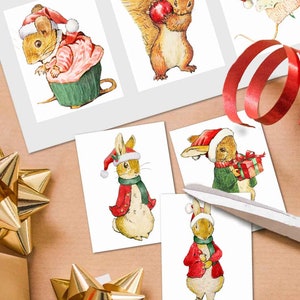 May include: Five Christmas-themed illustrations featuring a mouse, squirrel, and three rabbits wearing Santa hats. The illustrations are printed on white card stock.