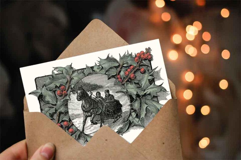 May include: A vintage Christmas card featuring a black and white illustration of a horse-drawn carriage with three people riding through a snowy landscape. The illustration is surrounded by a wreath of holly with red berries.