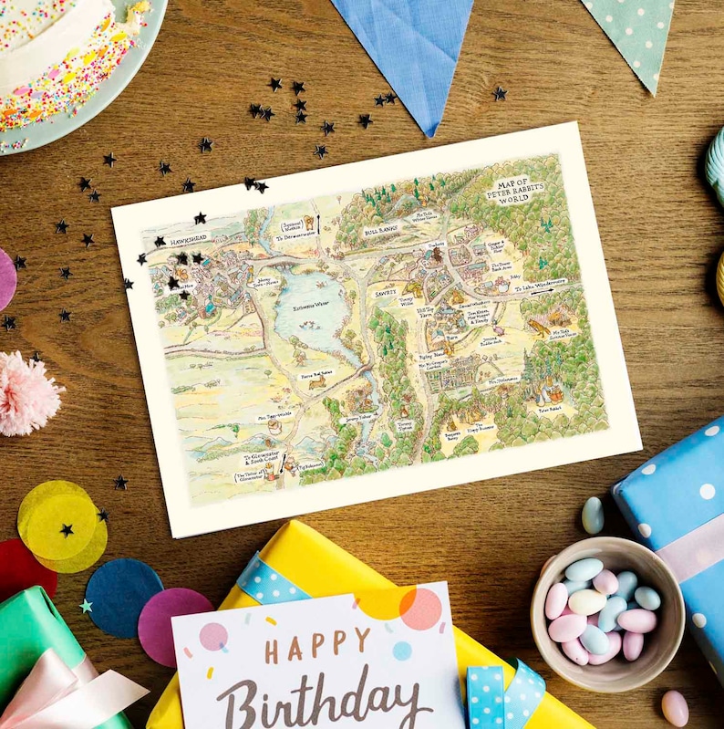 May include: A colorful map of Peter Rabbit's World, a fictional world from the children's book series by Beatrix Potter. The map is printed on white paper and features a variety of landmarks, including a lake, a forest, and a village. The map is surrounded by colorful decorations, including stars, confetti, and gift boxes.
