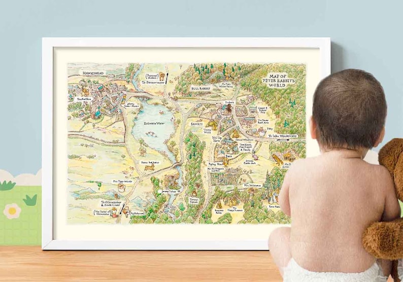 May include: A framed map of Peter Rabbit's World, a fictional world with a river, forest, and several buildings. The map is in a white frame and is being looked at by a baby.