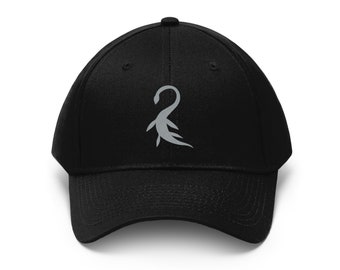 May include: A black baseball cap with a grey embroidered design of a stylized creature. The creature has a long neck and a tail.