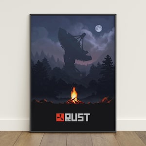 May include: A framed poster featuring a nighttime forest scene with a large satellite dish silhouetted against a cloudy sky and a full moon. A campfire burns brightly in the foreground, with the word "RUST" in white and red text.