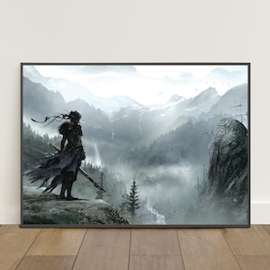 May include: A framed print featuring a fantasy illustration of a figure standing on a cliff overlooking a misty mountain range. The figure is clad in dark clothing and holds a sword. The artwork is rendered in shades of gray and white.