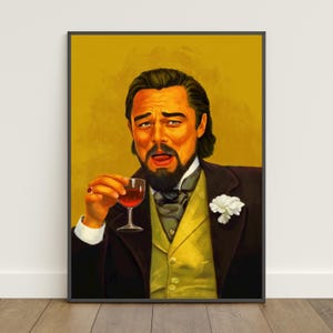May include: A framed print featuring a portrait of a man holding a glass of red wine, with a humorous expression. The man is wearing a dark suit, a yellow vest, and a white flower. The background is a solid yellow color.