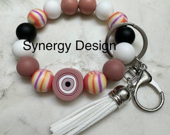Wristlet keychains- Evil Eye Mauve, white, black striped design