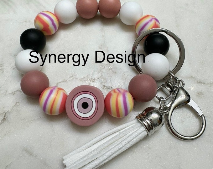 Wristlet keychains- Evil Eye Mauve, white, black striped design