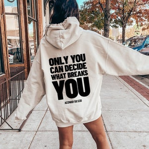 May include: A cream-colored hoodie with a black print that reads "Only you can decide what breaks you" and "ACOWMAR 58-530".