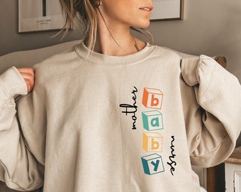 Mother Baby Nurse Sweatshirt, New Nurse Gift, Swaddle Specialist Shirt, Labor And Delivery Hoodie, Mother Baby Unit Nurse Tshirt, D6912