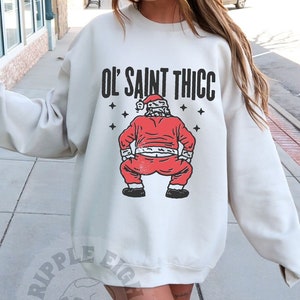 Funny Christmas T-Shirt Ol&#39; Saint Thicc Tee - Retro Style Santa Claus Graphic Tee - Humorous Holiday Unisex Top - Retro Xmas Gift, Santa