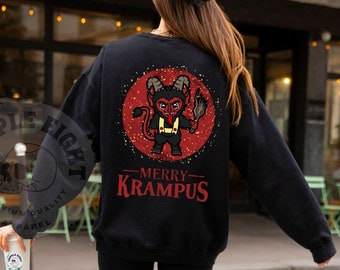 May include: Black sweatshirt with a red and gold illustration of a Krampus figure holding a stick. The text "Merry Krampus" is printed below the illustration.