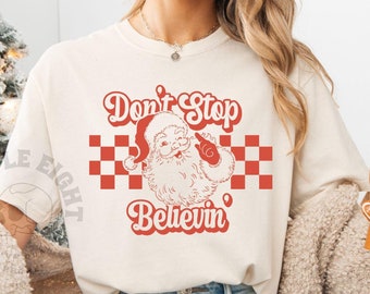 Don't Stop Believing Santa Shirt, Santa Claus Shirt, Checkered Santa Claus Shirt, Womens Oversized Santa Claus Shirt, Xmas Comfort Colors