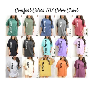 May include: A color chart of Comfort Colors 1717 t-shirt dresses in various colors, including light green, moss, blue jean, gray, cumin, black, pepper, chalky mint, violet, orchid, white, ivory, mustard, yam, and berry. The text "Comfort Colors 1717 Color Chart" is at the top.