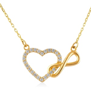 May include: A gold necklace with a heart and infinity symbol pendant. The pendant is adorned with small clear stones.