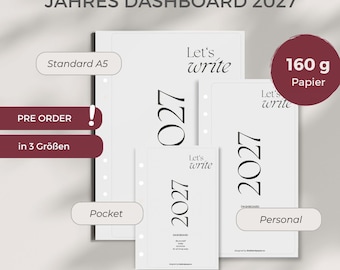May include: Three white planner dashboard inserts labeled 2027 and Let's write, featuring punched holes for binding. The set includes Standard A5, Personal, and Pocket sizes, all printed on 160 g paper. The text includes JAHRES DASHBOARD 2027.