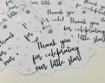 May include: White cloud-shaped thank you tags with pink stars and black text that reads "Thank you for celebrating our little star!"